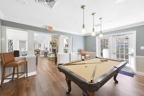 Edgewater apartment for rent - Resident clubhouse with billiards table and lounge seating at Victoria Park at Edgewater Apartments, Maryland