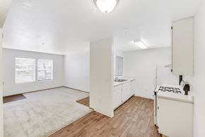 Elk Grove apartment for rent - Open concept kitchen and living area with hardwood flooring at Renwick Square Apartments, California