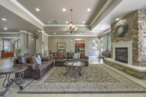 Rocklin apartment for rent - Community clubhouse lounge with stone fireplace accent at Whitney Ranch Apartments, Rocklin, California