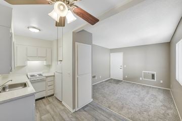 Duarte apartment for rent - A kitchen with a sink, stove, and refrigerator with a fan in the ceiling.