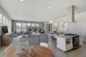Sacramento apartment for rent - Open concept living space with modern kitchen island at Anton Arcade Apartments, Sacramento, California