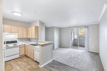 Elk Grove apartment for rent - A kitchen with white appliances and wooden cabinets.