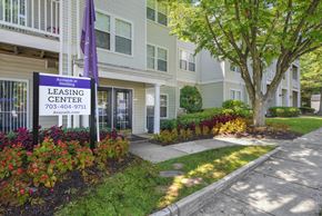 Sterling apartment for rent - A leasing center sign in front of a building at Acclaim at Sterling, Sterling, VA, 20164