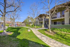 Yorba Linda apartment for rent - A sunny day at a residential area with apartment buildings and a playground at Yorba Linda Apartments, Yorba Linda, CA