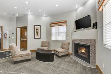 Denver apartment for rent - A living room with a fireplace and a television.