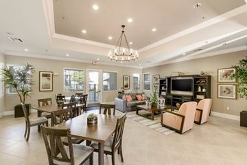 Dixon apartment for rent - A well-lit, spacious living room with a dining table and chairs.