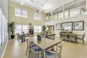 Roseville apartment for rent - A dining room with a long table and chairs.
