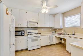 Roseville apartment for rent - A kitchen with white appliances and cabinets.