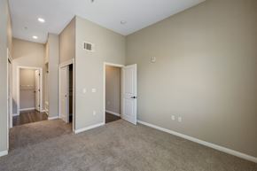 American Canyon apartment for rent - A spacious room with beige walls and carpeted floor.