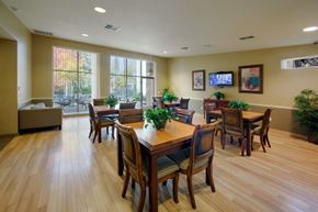 Oakland apartment for rent - A dining room with a wooden table and chairs.