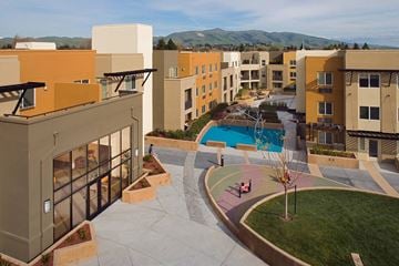 New York apartment for rent - Apartment complex with a pool and a view of the mountains.