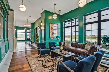 Dallas apartment for rent - A living room with a blue couch and a brown leather couch.