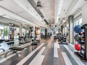 Dallas apartment for rent - a spacious fitness center with treadmills and other exercise equipment