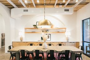 Dallas apartment for rent - A dining room with a wooden table and chairs.