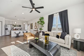 Windsor apartment for rent - A modern living room with a black coffee table and a white sofa.