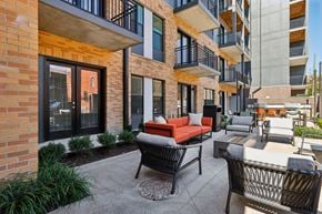 Cincinnati apartment for rent - Private balcony at Contrast OTR offering TQL Stadium views and modern black metal railings overlooking Cincinnati.