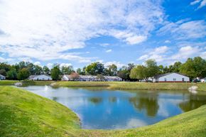 Terre Haute apartment for rent - lake view with grass at Shady Oak Village - Senior Living Apartments, IN, 47802