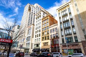 Indianapolis apartment for rent - a city street with tall buildings and a blue sky in the background at 26 West, Managed by Buckingham Urban Living, Indianapolis