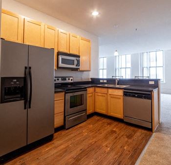 Fully equipped kitchen includes frost-free refrigerator, electric range, & dishwasher
