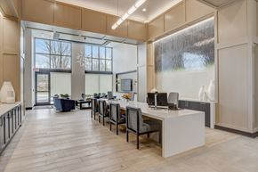 Carmel apartment for rent - an office space with a desk and chairs and a large window