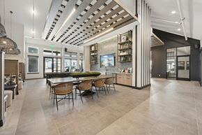Windsor apartment for rent - A modern dining room with a large table and chairs.