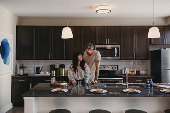 Fitted kitchen with island dining