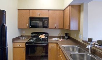 Stainless steel sink with faucet in kitchen