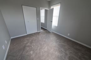 Indianapolis apartment for rent - Bedroom with carpet and natural light from window at The Argyle on Mass Ave, Indiana, 46202