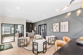 Brownsburg apartment for rent - A modern dining area with a black table and white chairs.