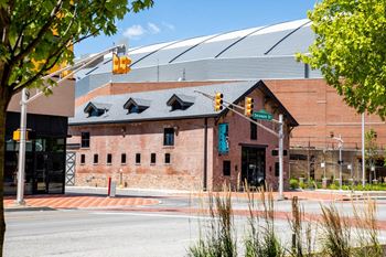 A red brick building with a large dome on top of it