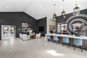 Indianapolis apartment for rent - A modern dining room with a long table and chairs.