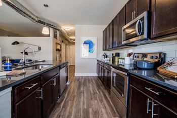 Fully equipped kitchen includes frost-free refrigerator, electric range, & dishwasher