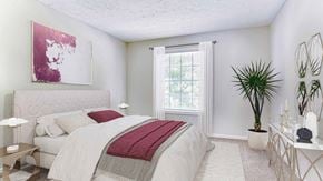 Marietta townhouse for rent - a white bedroom with a bed and a window at Elea Apartments in Marietta, GA