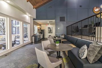 Atlanta apartment for rent - a living room with couches and chairs and a table