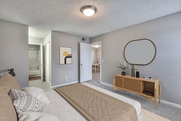 Nashville apartment for rent - A living room with a couch and a wooden shelf.