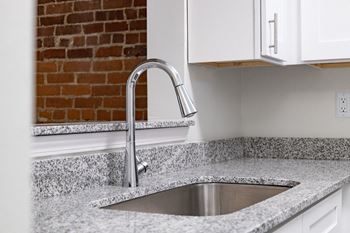 Stainless steel sink with faucet in kitchen