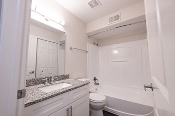Large soaking tub with tile backslash