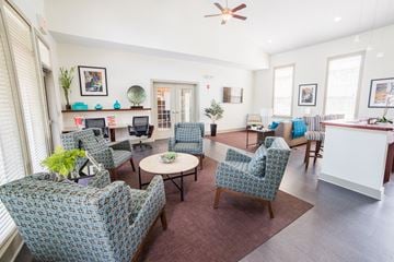 Indianapolis apartment for rent - a living room with blue chairs and a kitchen