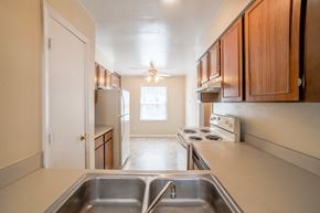 Indianapolis apartment for rent - the view of a kitchen with a sink and a refrigerator