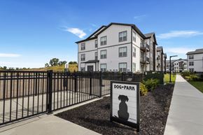 West Lafayette apartment for rent - Fenced dog park beside apartment buildings at Montage West Lafayette apartments in West Lafayette, IN.