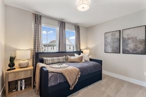 Lewis Center apartment for rent - Comfortable apartment bedroom at Mural Lewis Center featuring large windows with natural light, plush bedding, neutral color palette, ceiling light fixture, and modern decor