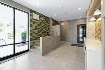 A large bathroom with a large shower and a sink