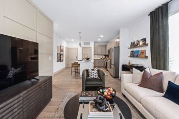 A living room with a couch and a table