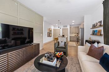 A living room with a couch and a table
