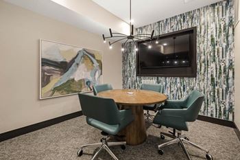 A conference room with a table and chairs