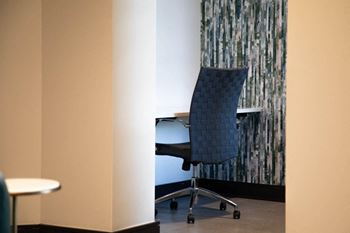 A desk with a chair in a room