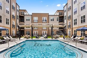 Carmel apartment for rent - A large, inviting swimming pool at the center of the Portrait Midtown apartment community courtyard.