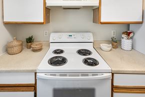 Avon apartment for rent - Kitchen Stove and White Cabinetry at Steeplechase at Shiloh Crossing