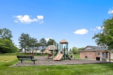 Avon apartment for rent - A playground with a green slide and a brown tower.