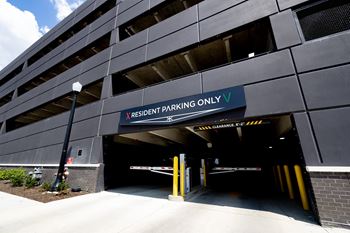 A parking garage with a sign that says reserved parking only